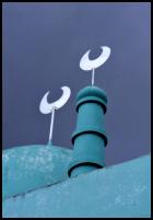 Crescent moons against a stormy monsoon sky, Vientiane, Laos.